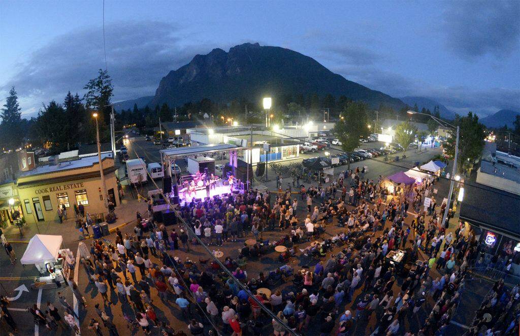 A crowd forms at the Main Stage for a concert at the North Bend Downtown Block Party in 2016. File photo.