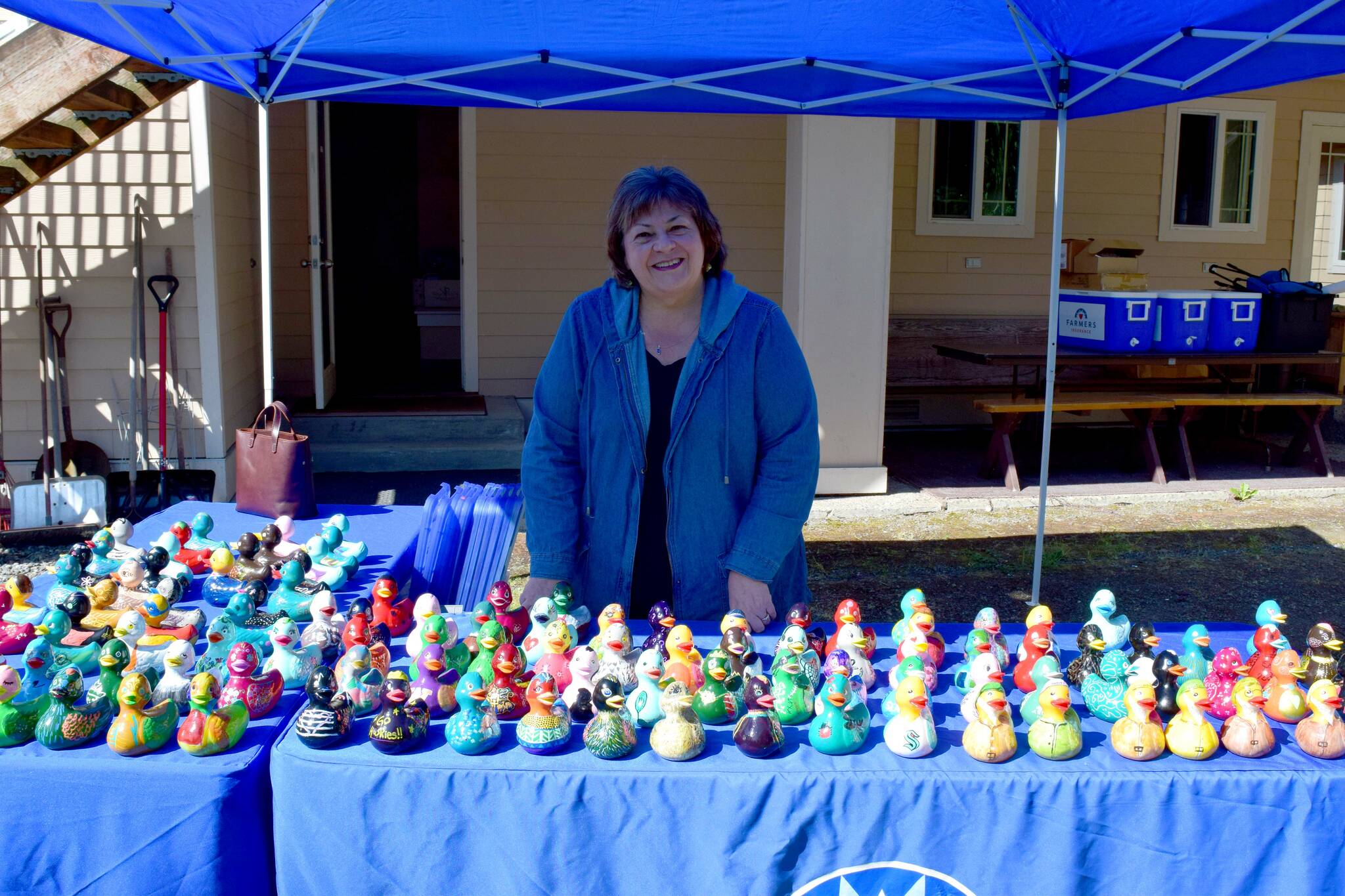 Laurie Hauglie poses in front of the 100-plus painted ducks. All photos by Conor Wilson/Valley Record.
