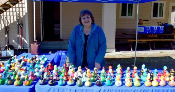 All photos by Conor Wilson/Valley Record
Laurie Hauglie poses in front of the 100-plus painted ducks.