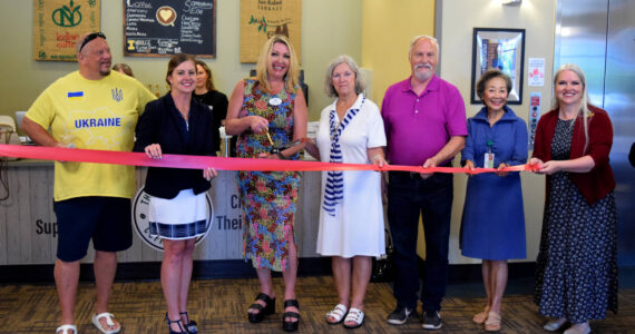 Tonya Guinn stands next to her parents celebrating the opening of her second coffee shop inside Snoqualmie Valley Hospital. From left: Tom Armour, SVH CEO Renee Jensen, Guinn, her parents, Hospital Board Vice President Jen Carter, and boardmember Emma Herron. Photo by Conor Wilson/Valley Record.