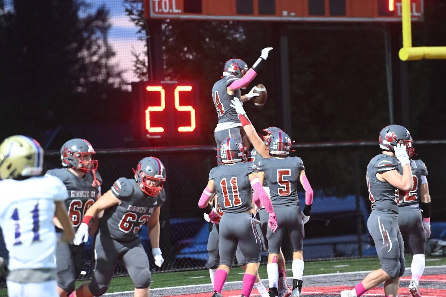The Wildcats hoist wide receiver Dillon McCaffery after he scores a first quarter touchdown. Photo Courtesy of Calder Productions.