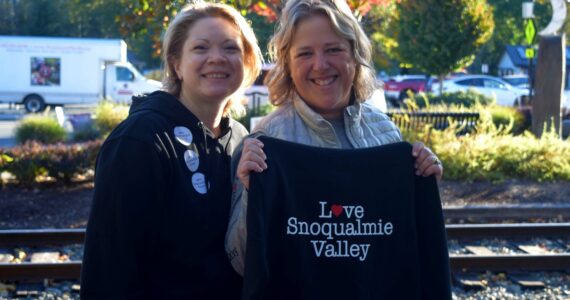 Snoqualmie Trading Co. Owners Heather Dean (left) and Cheri Buell sell Love Snoqualmie Valley merch at Volunteer Day. Half of the proceeds went back into the community, Dean said. Photos by Conor Wilson/Valley Record.