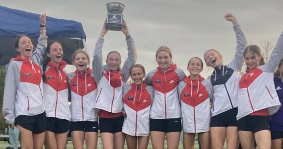 Courtesy photo
The Mount Si Girls Cross Country team hoists the KingCo Trophy.