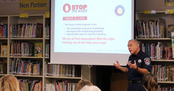 Robert Angrisano teaches the department’s ‘Stop the Bleed’ course to Opstad Elementary teachers and staff in 2019. Madison Miller/ File photo.