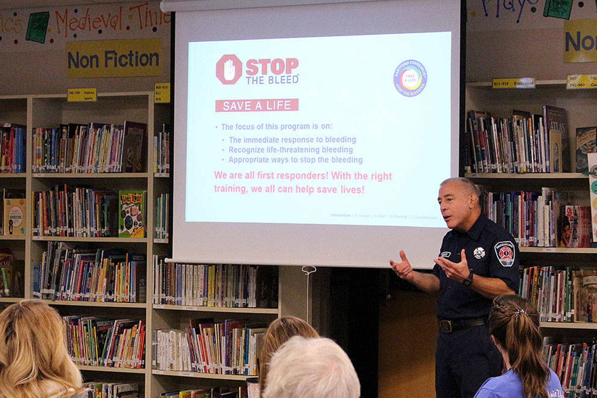 Robert Angrisano teaches the department’s ‘Stop the Bleed’ course to Opstad Elementary teachers and staff in 2019. Madison Miller/ File photo.
