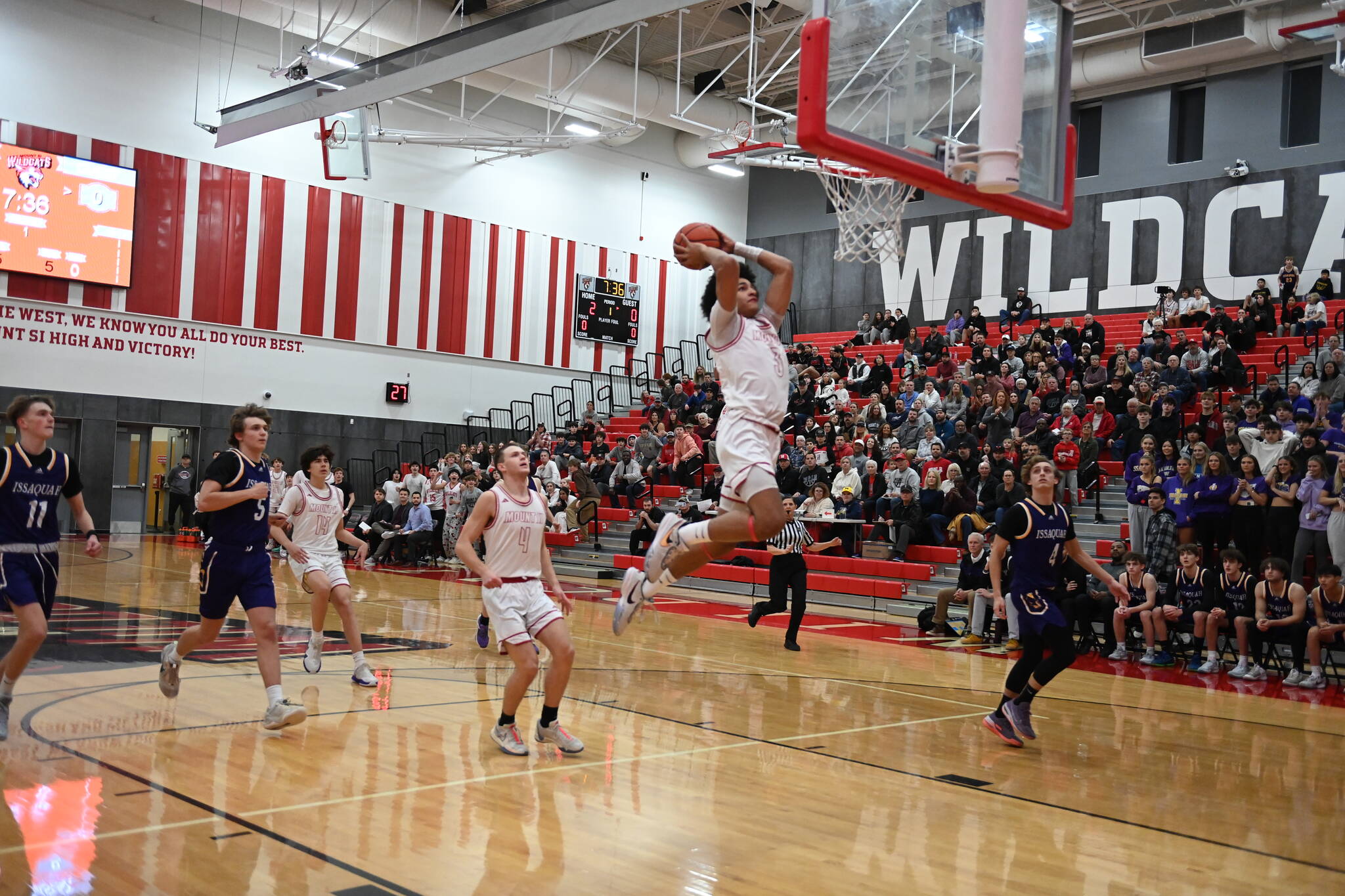 Photo Courtesy of Calder Productions. Mount Si Sophomore Lattimore Ford goes for a dunk in the Wildcats season opener against Issaquah on Dec. 4.