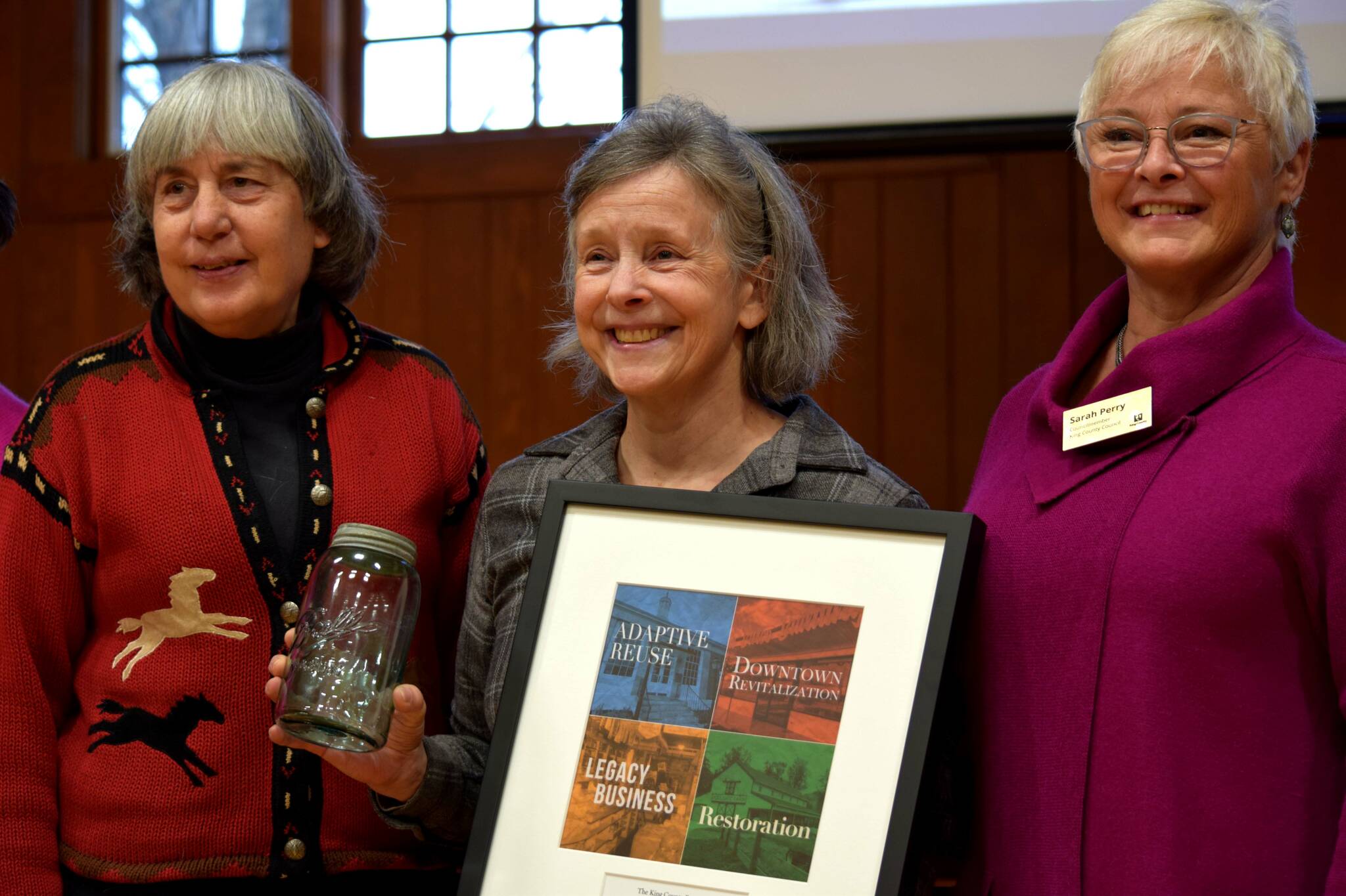 Carmichael’s Store owner Wendy Thomas, center, poses with King County Councilmember Sarah Perry, right, and Mary Norton at the John D. Spellman Awards ceremony in North Bend on Dec. 7. Photos Conor Wilson/Valley Record.