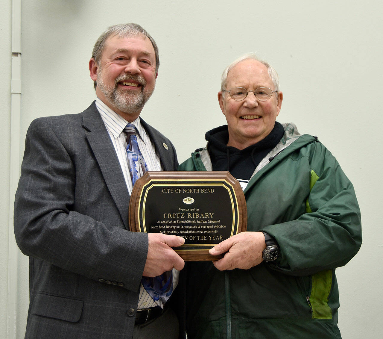 In this file photo, former North Bend Mayor Ken Hearing congratulates Fritz Ribary, who was named the 2018 North Bend Citizen of the Year. File photo