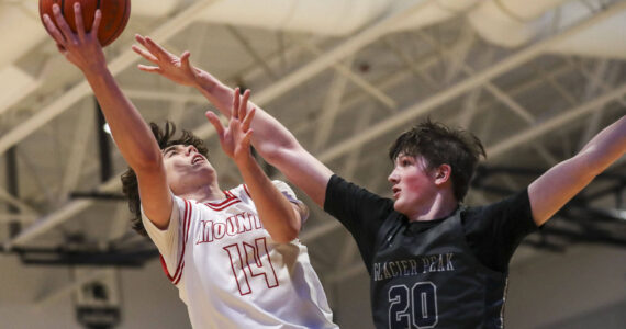 Mount Si’s Marcus Heide (14) shoots the ball during a boys Class 4A bi-district title game between Glacier Peak and Mount Si at North Creek High School on Friday, Feb. 16, 2024 in Bothell, Washington. The Wildcats won, 59-53.(Annie Barker / The Herald)