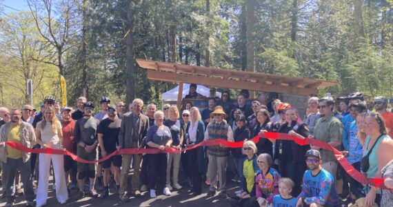 North Bend Mayor Mary Miller cut the ribbon at Tennant Trailhead Park on April 19. (Photo by Mallory Kruml/Valley Record)