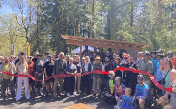 North Bend Mayor Mary Miller cut the ribbon at Tennant Trailhead Park on April 19. (Photo by Mallory Kruml/Valley Record)
