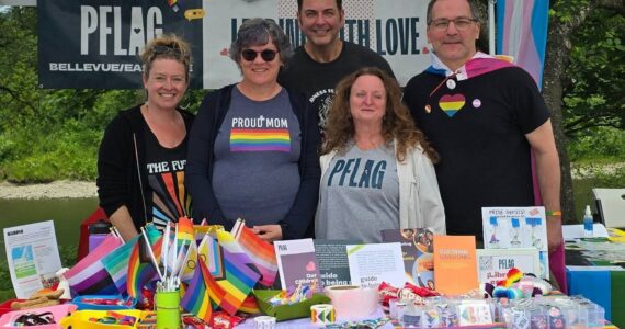 SnoValley Pride founder Gregory Jamiel (center) stands with members of PFLAG (Parents, Families and Friends of Lesbians and Gays) at Fall City Day 2025. Photo courtesy of SnoValley Pride