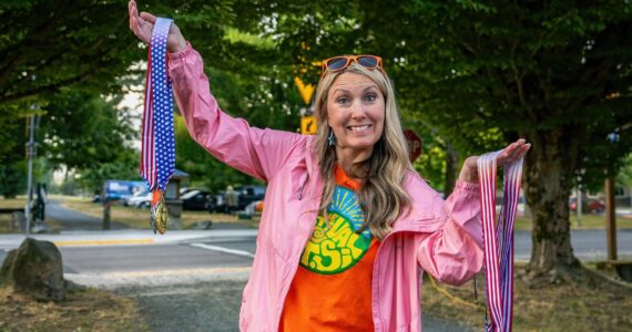 North Bend Downtown Foundation Executive Director Jessica Self prepares to hand out medals at the Festival at Mount Si 5k run, Aug. 9, 2025. 
Photo courtesy of KKPJ Photography
