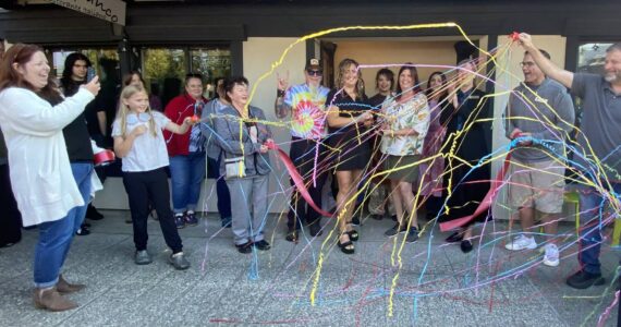 William Shaw/Valley Record
Chickadee Bakeshop’s owners cut the ribbon on their new bakery, surrounded by community members, Oct. 6, 2025.