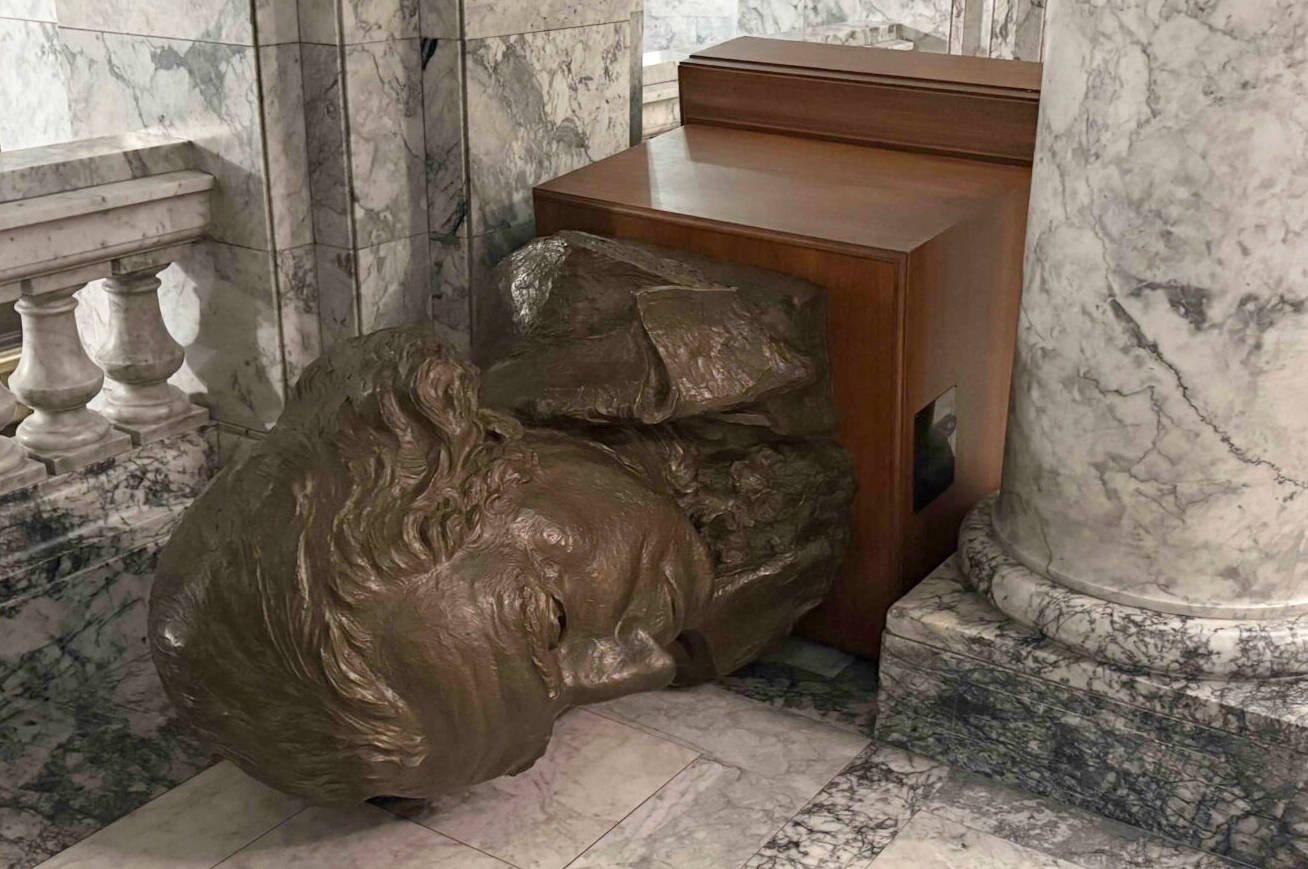 A bust of George Washington lies tipped over on the third floor of the Washington state Capitol building in Olympia, after a vandal broke in and caused damage on Sunday night. (Photo courtesy of Department of Enterprise Services)