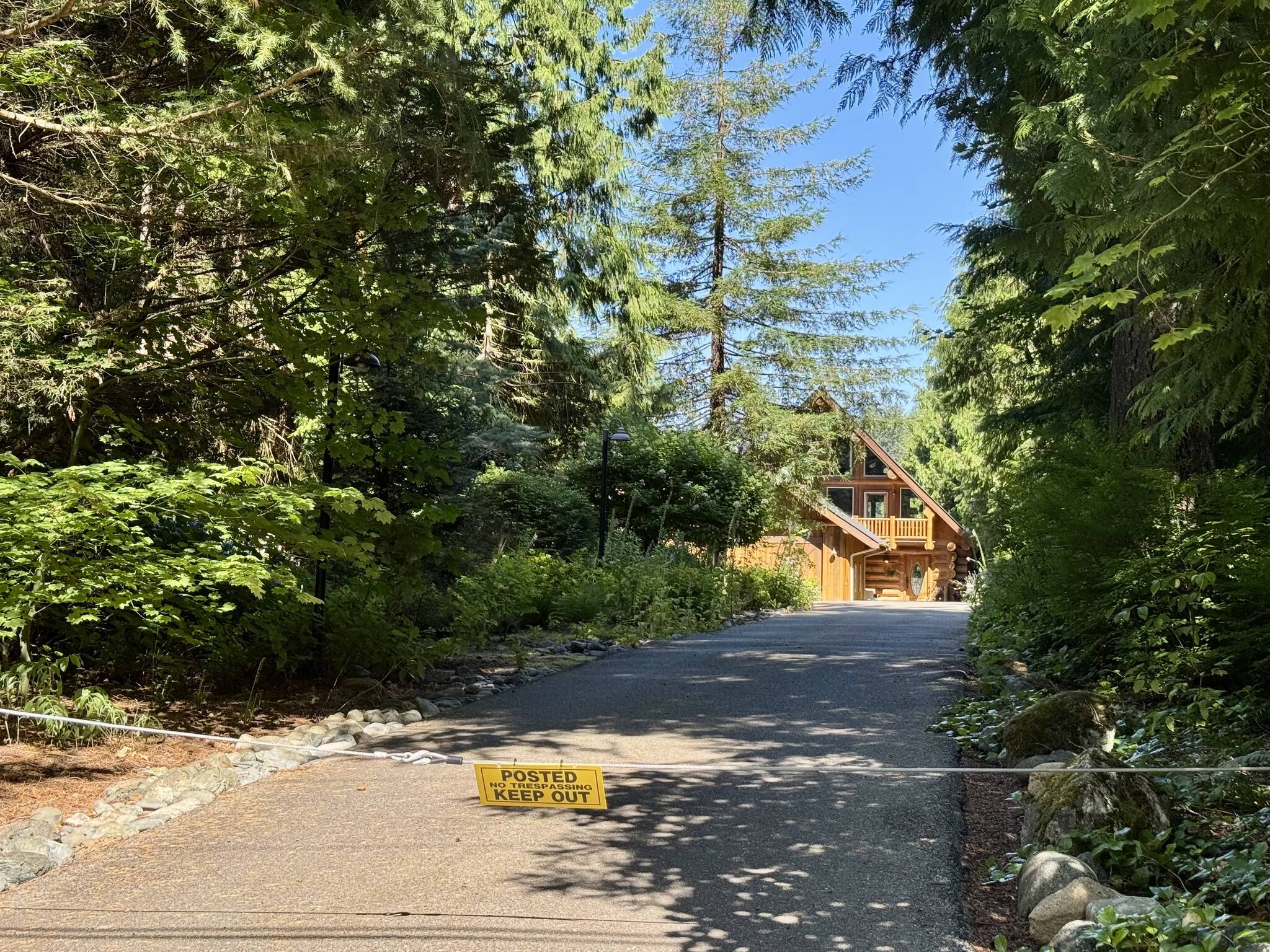 The Lake Alice home of the Humiston family has a no trespassing sign posted at the end of the driveway, July 11, 2025. (Grace Gorenflo/Valley Record)