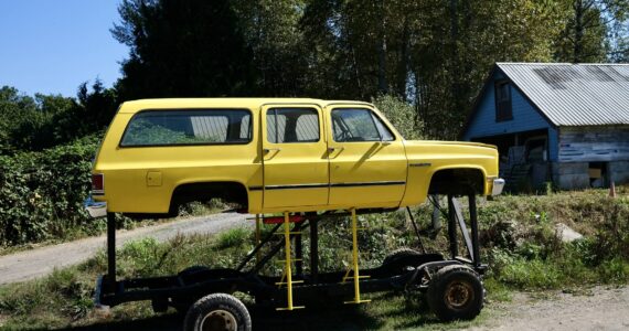 The “Floodmobile,” a Chevrolet Suburban raised to drive through flood waters, sits on Cook Farm, Sept. 16, 2025. This iteration of the Floodmobile is owned by Dan Cook, with an earlier version being owned by his father. Cook says he hasn’t had to use the Floodmobile in many years, but he still brings it out for Duvall parades and events. (Grace Gorenflo/Valley Record)