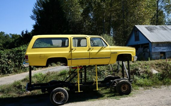 The “Floodmobile,” a Chevrolet Suburban raised to drive through flood waters, sits on Cook Farm, Sept. 16, 2025. This iteration of the Floodmobile is owned by Dan Cook, with an earlier version being owned by his father. Cook says he hasn’t had to use the Floodmobile in many years, but he still brings it out for Duvall parades and events. (Grace Gorenflo/Valley Record)