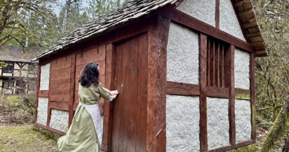 Camlann Medieval Village Executive Director Lauren Poyer shows a cottage at Camlann, March 9, 2025. Photo by Grace Gorenflo/Valley Record