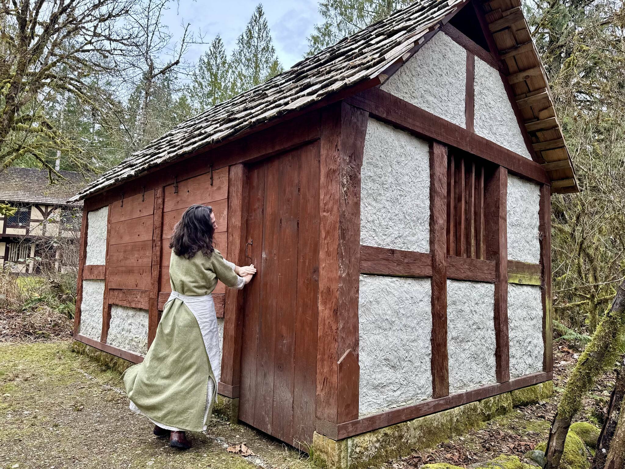 Camlann Medieval Village Executive Director Lauren Poyer shows a cottage at Camlann, March 9, 2025. Photo by Grace Gorenflo/Valley Record