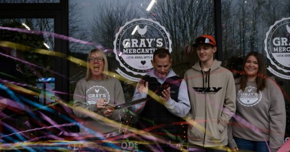 The Stumpf family celebrates after Gray’s Mercantile founder Summer Stumpf cuts the ribbon, Nov. 15, 2025. (Grace Gorenflo/Valley Record)