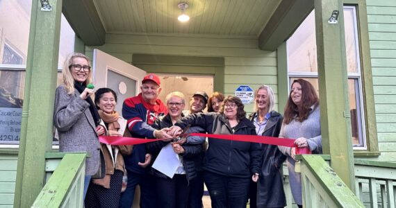 Chaplain Patti Yetneberk and her team prepare to cut the ribbon on the new Snoqualmie Valley Healing Center, Nov. 6, 2025. (Grace Gorenflo/Valley Record)