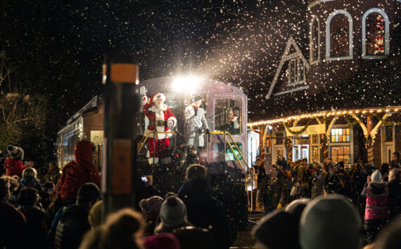 Mayor Katherine Ross arrives with Santa Claus during the Snoqualmie Winter Lights celebration on Dec. 7, 2024, in Snoqualmie, Washington. Photo by Henry Rodenburg