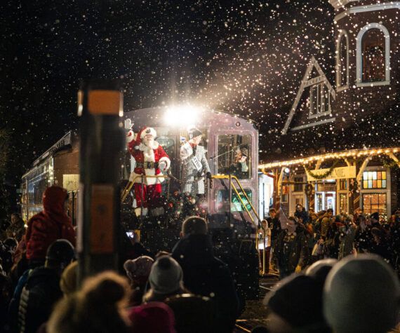 Mayor Katherine Ross arrives with Santa Claus during the Snoqualmie Winter Lights celebration on Dec. 7, 2024, in Snoqualmie, Washington. Photo by Henry Rodenburg