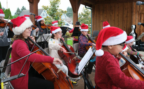 Members of the Tolt Strings musical group perform under the direction of Myra Chaney (not pictured) during the Christmas in Carnation event on Dec. 6. Photo by Aaron Gustafson
