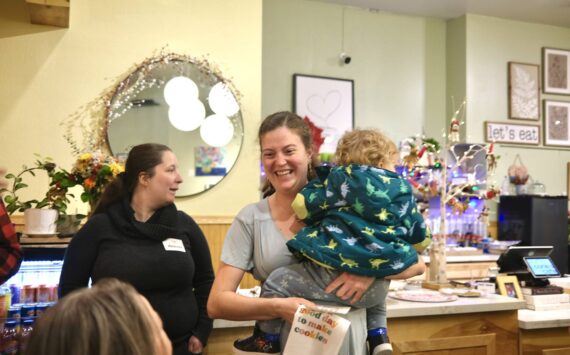 Friends and family of Corie’s Cafe owner Corie Goodloe tally the votes at the Great Duvall Bake Off, Dec. 6, 2025. (Grace Gorenflo/Valley Record)