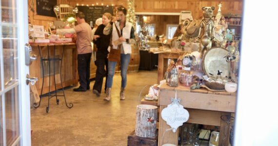 Shoppers peruse a holiday market at Misty Valley Farm, Dec. 7, 2025. (Grace Gorenflo/Valley Record)