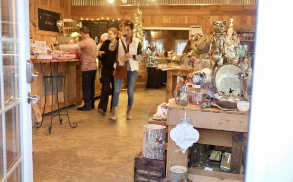 Shoppers peruse a holiday market at Misty Valley Farm, Dec. 7, 2025. (Grace Gorenflo/Valley Record)