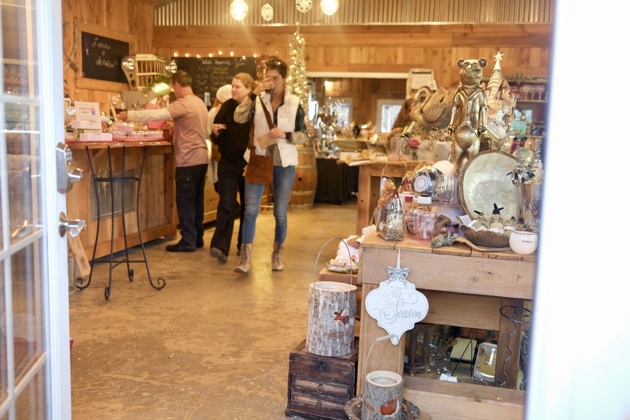 Shoppers peruse a holiday market at Misty Valley Farm, Dec. 7, 2025. (Grace Gorenflo/Valley Record)