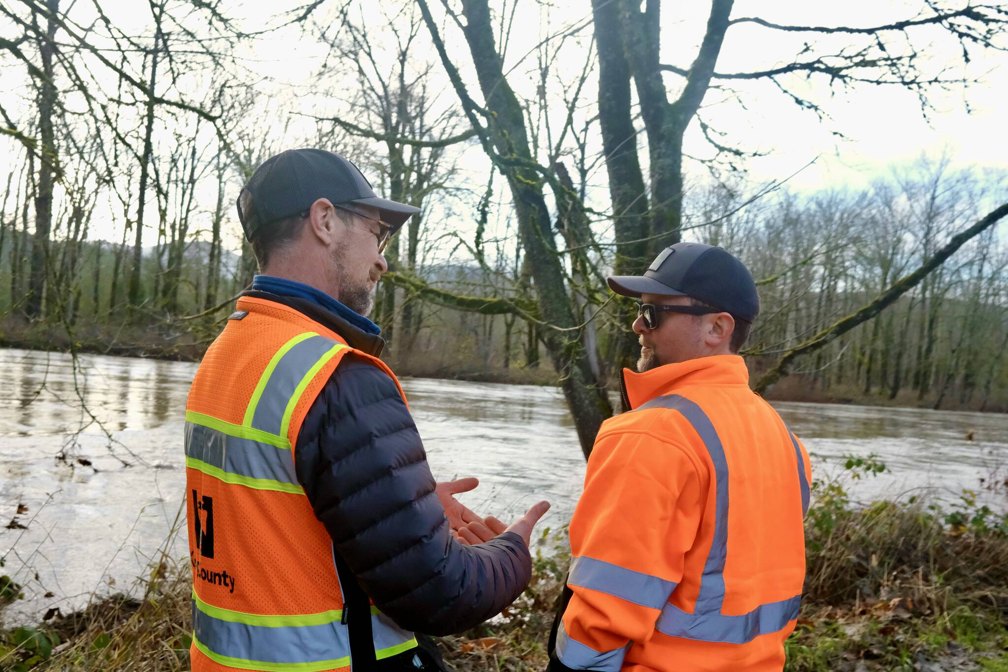 King County Flood Patrol members Thomas Bannister (left) and Seth Ballhorn on their patrol route, Dec. 9, 2025. Grace Gorenflo/Sound Publishing