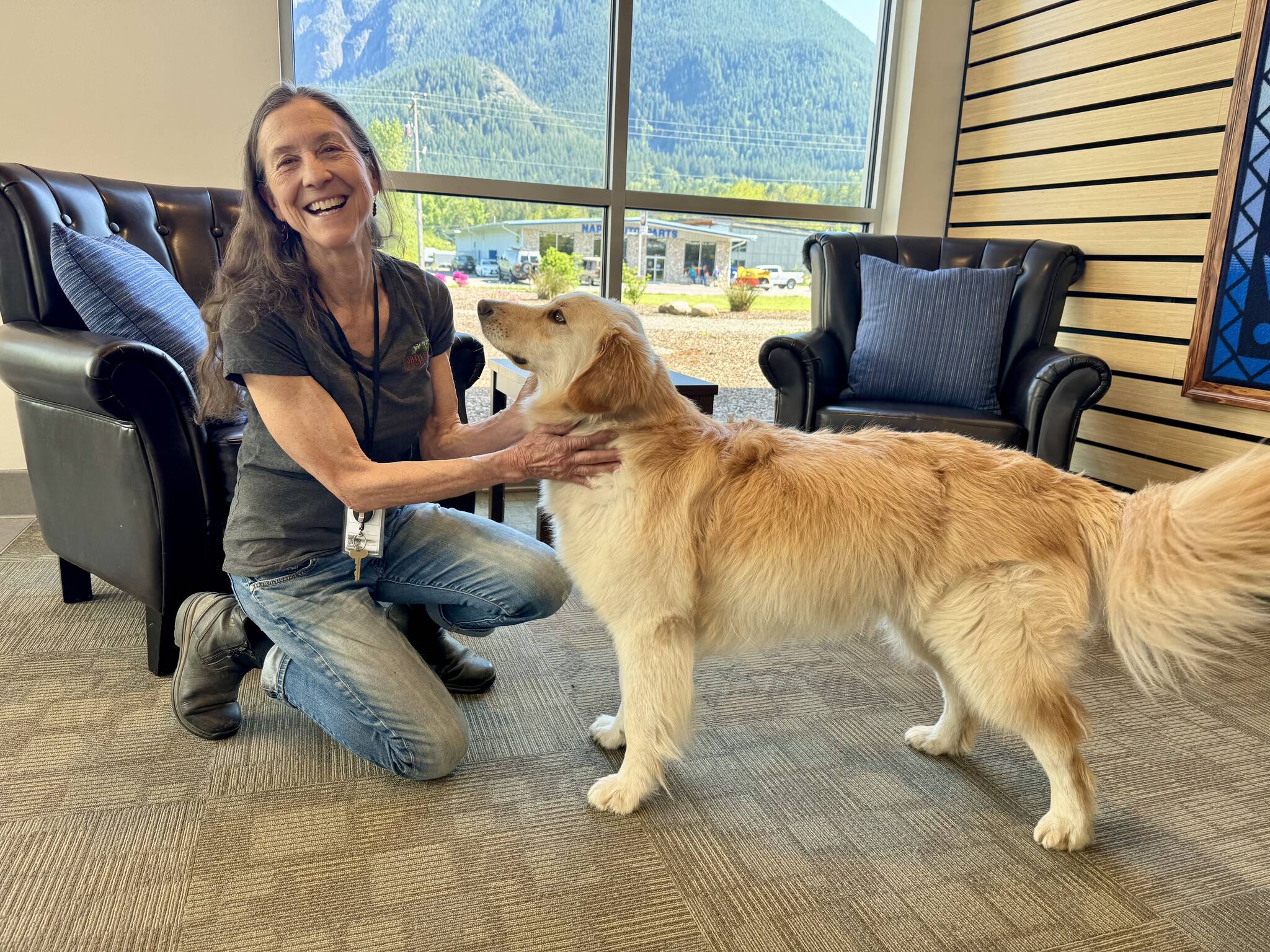 North Bends Administrative Services Director Lisa Escobar with her dog, Harley, at North Bend City Hall, May 2, 2025.