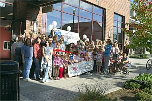 Members of the Snoqualmie Valley Chamber of Commerce celebrate the move by Cascade Dance Academy to its new location on Snoqualmie Ridge.