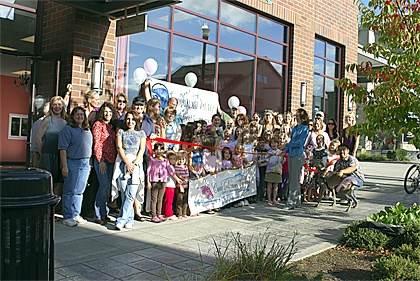 Members of the Snoqualmie Valley Chamber of Commerce celebrate the move by Cascade Dance Academy to its new location on Snoqualmie Ridge.