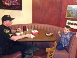 Lunch with a hero: Boy shares meal at Candy Factory with officer