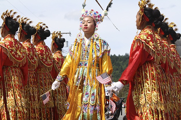 2nd Lt. Monica Lui crosses Tolt Avenue in formation with the Seattle Chinese Community Girls Drill Team