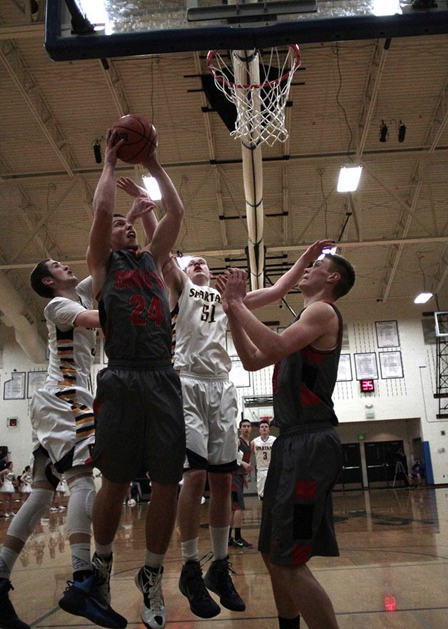 Beau Shain makes a jump shot against the Spartans