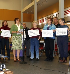 Members of the Sno-Valley Senior Center wave signs at the King County Council Budget Leadership Team's Oct. 12 public hearing in Snoqualmie. Center funding looks to be preserved in spite of the proposed elimination of county human services funding in the wake of $60 million in general fund cuts.