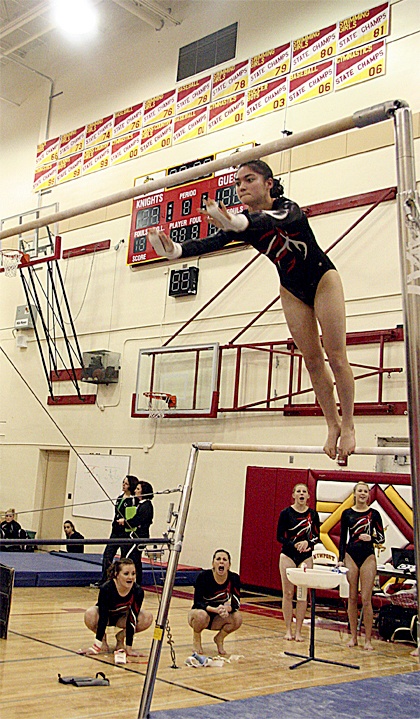 Mount Si High School varsity gymnast Georgia Reynolds leaps on the bars during competition against Newport and Interlake Thursday