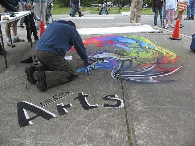 Brian Major brings a dragon to life on the pavement in the 2011 Fall City Days. He returns with his eye-popping chalk art Saturday.