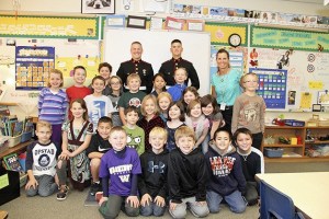 Marine privates and Mount Si grads Cameron Pike and Blake Moorhead meet with students in Sharon Piper's class during a recent visit. Pike and Moorhead just finished boot camp with awards.