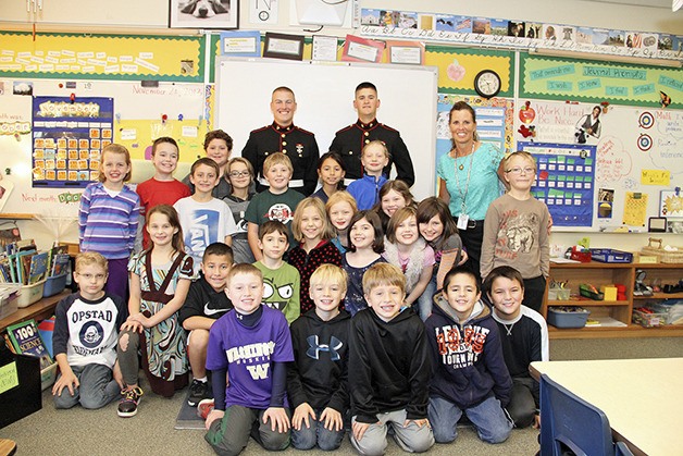 Marine privates and Mount Si grads Cameron Pike and Blake Moorhead meet with students in Sharon Piper's class during a recent visit. Pike and Moorhead just finished boot camp with awards.