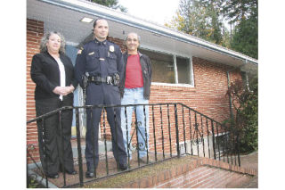 Snoqualmie Tribal Police Chief Duane Garvais-Lawrence center is flanked by new administrative assistant Veronica Port and Tribal Council Chairman Joe Mullen