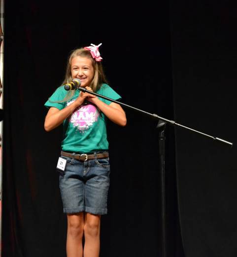 Abigail Hamilton takes the mic at the National American Miss State Pageant. She placed 4th Runner-Up in the Actress Competition and 4th Runner-Up in Casual Wear.