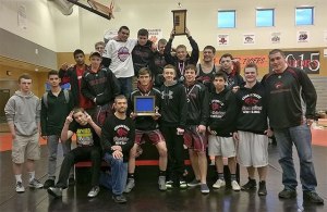 The Cedarcrest High School wrestling squad and coaches celebrate their victory at sub-regional competition Feb. 7.