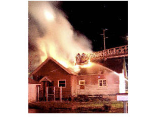 Next-door neighbors Dan and Sheri Loepke got a shot of fire crews battling a North Bend home fire in the early hours of Sunday