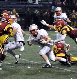 Connor Deutsch makes a carry attempt for Mount Si in the fourth quarter of the state playoff game vs. O'Dea.